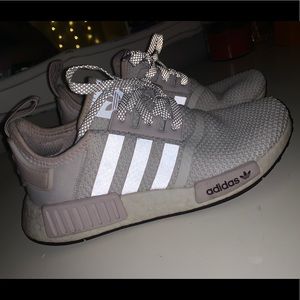 White and pink Adidas NMDs